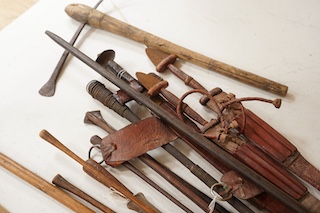 A quantity of African tribal spears swords and tools. Condition - varies